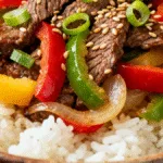 Delicious Beef Pepper Rice Bowl with Colorful Vegetables and Rice