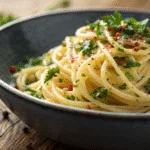 Bowl of authentic Spaghetti Aglio e Olio with garlic, olive oil, and parsley, perfect for a quick dinner