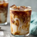 Delicious caramel iced coffee served with whipped cream and caramel drizzle