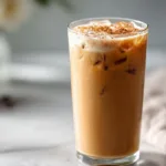 Refreshing Brown Sugar Vanilla Iced Coffee served in a glass with ice cubes.