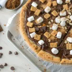 Delicious Campfire S'mores Pizza with melted chocolate and marshmallows