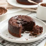 One minute chocolate mug cake topped with chocolate sprinkles in a white mug