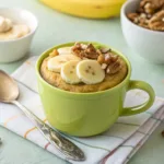Single serving paleo banana cake topped with nuts and banana slices