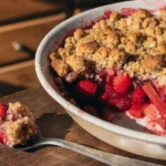 Freshly baked Strawberry Rhubarb Crunch dessert with crumbly topping