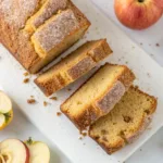 Delicious apple cider doughnut loaf cake served on a rustic wooden table