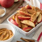 Crispy healthy apple fries served in a bowl with dipping sauce